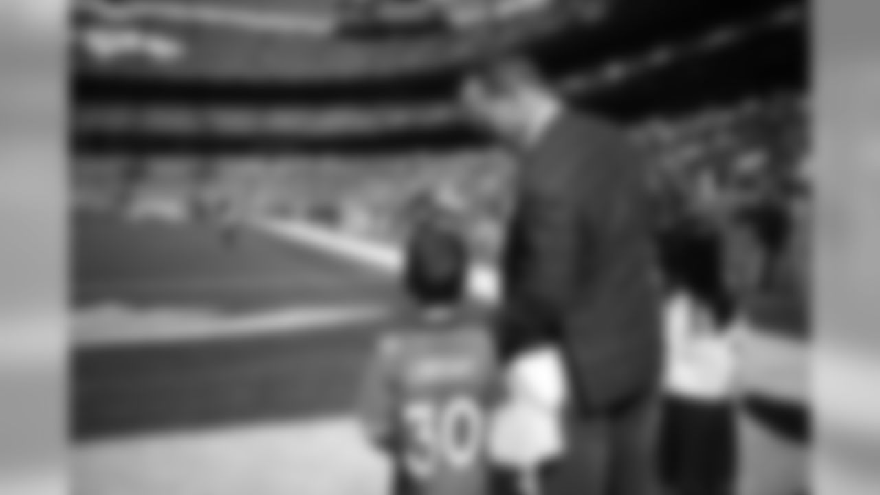 Peyton Manning and son Marshall and daughter Mosley look out onto the field before the Broncos' game against the Tennessee Titans at Empower Field at Mile High in Denver, Colorado, October 13, 2019.
Photo by Gabriel Christus