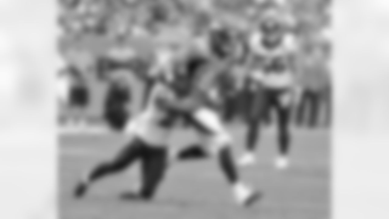 TE Jacob Tamme tries to fight off the defender for extra yards after a catch.