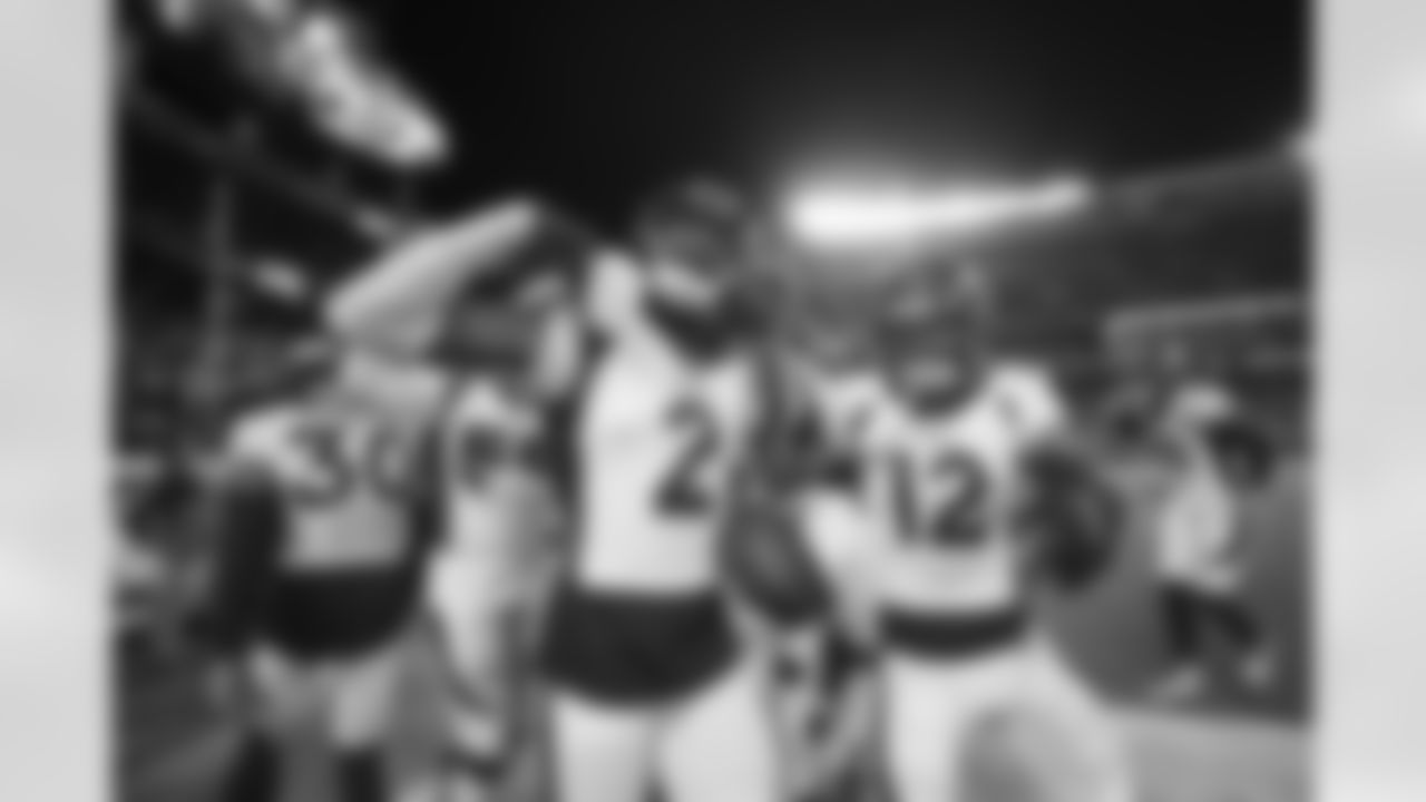 Denver Broncos cornerback Pat Surtain II (2) celebrates with safety Caden Sterns (30), cornerback Mike Ford (12) and other team mates after an interception during the NFL game against the Kansas City Chiefs on Sunday, December 5, 2021 at GEHA Field at Arrowhead in Kansas City Chiefs, Missouri.
Photo by Gabriel Christus