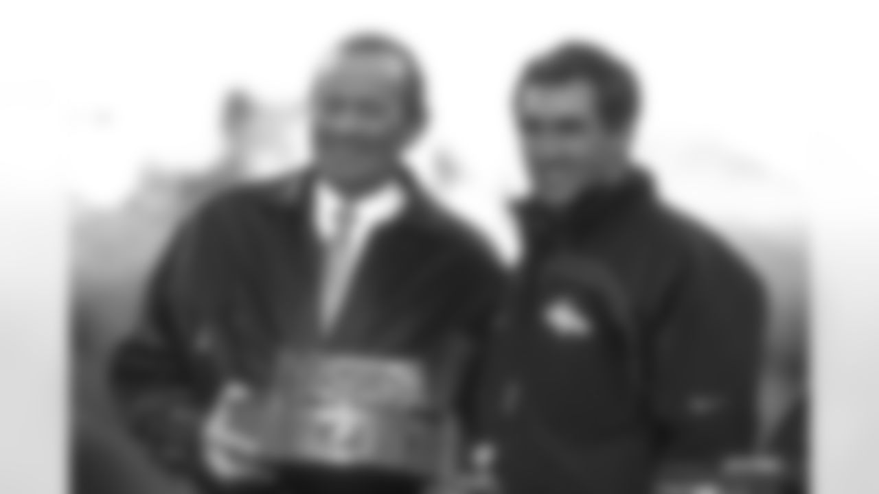Pittsburgh: Owner Pat Bowlen and Head Coach Mike Shanahan pose with the AFC Championship trophy after the Broncos victory against the Pittsburgh Steelers at Three Rivers Stadium in Pittsburgh, PA on January 11, 1998.