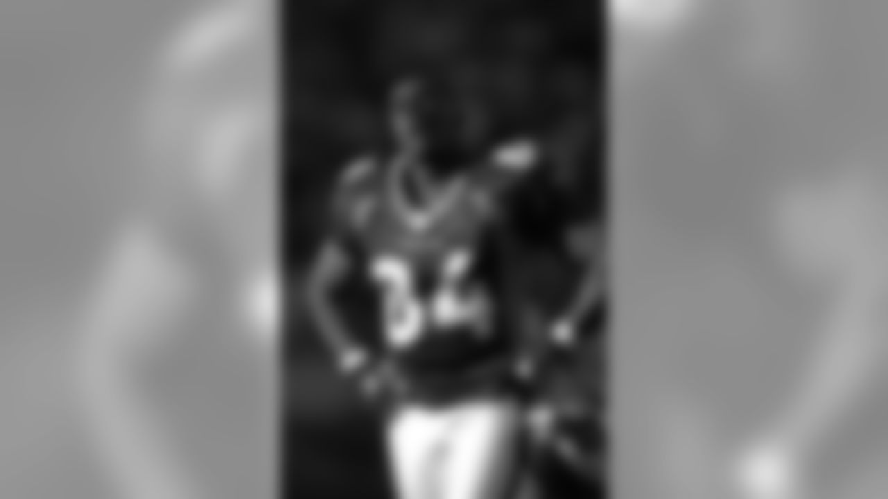 Shannon Sharpe watches highlights on the scoreboard during a game against the San Diego Chargers at Invesco Field at Mile High in Denver, CO on October 6, 2002.