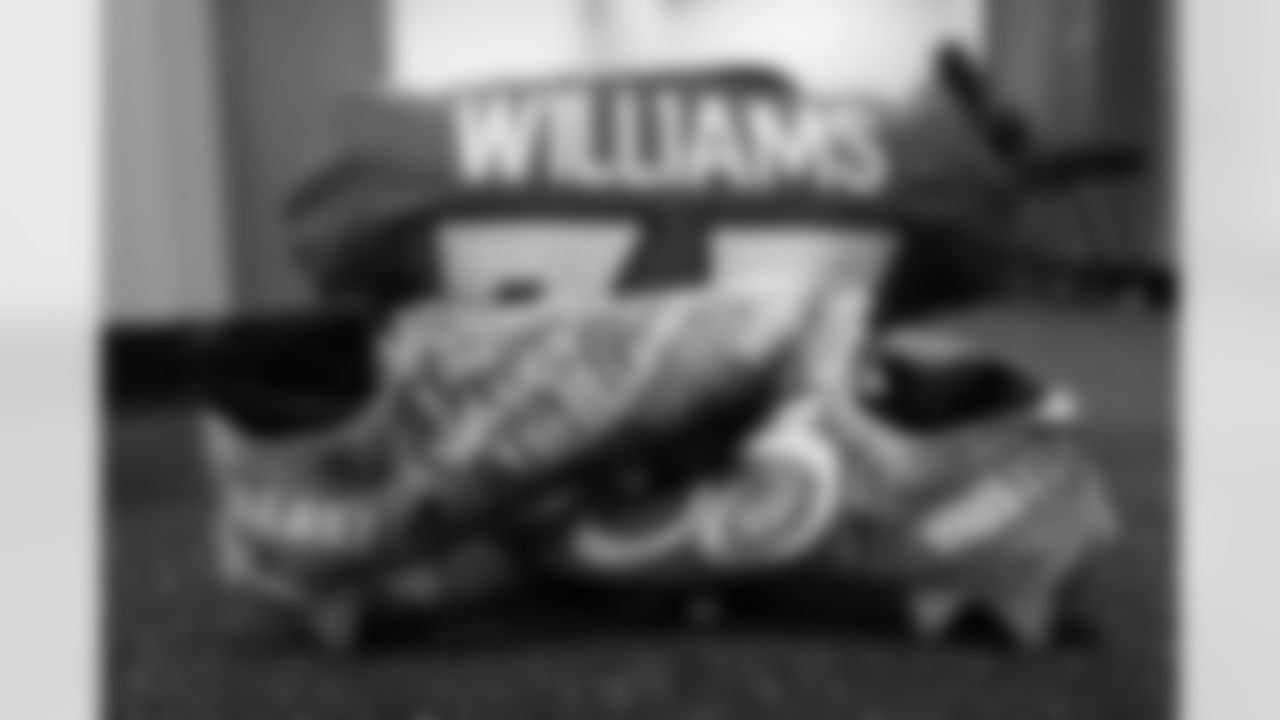 Javonte Williams's cleats in the locker room before the Broncos' Week 8 game against the Washington Football Team at Empower Field at Mile High in Denver, Colorado on October 31, 2021. (Photo by Sam Weaver)