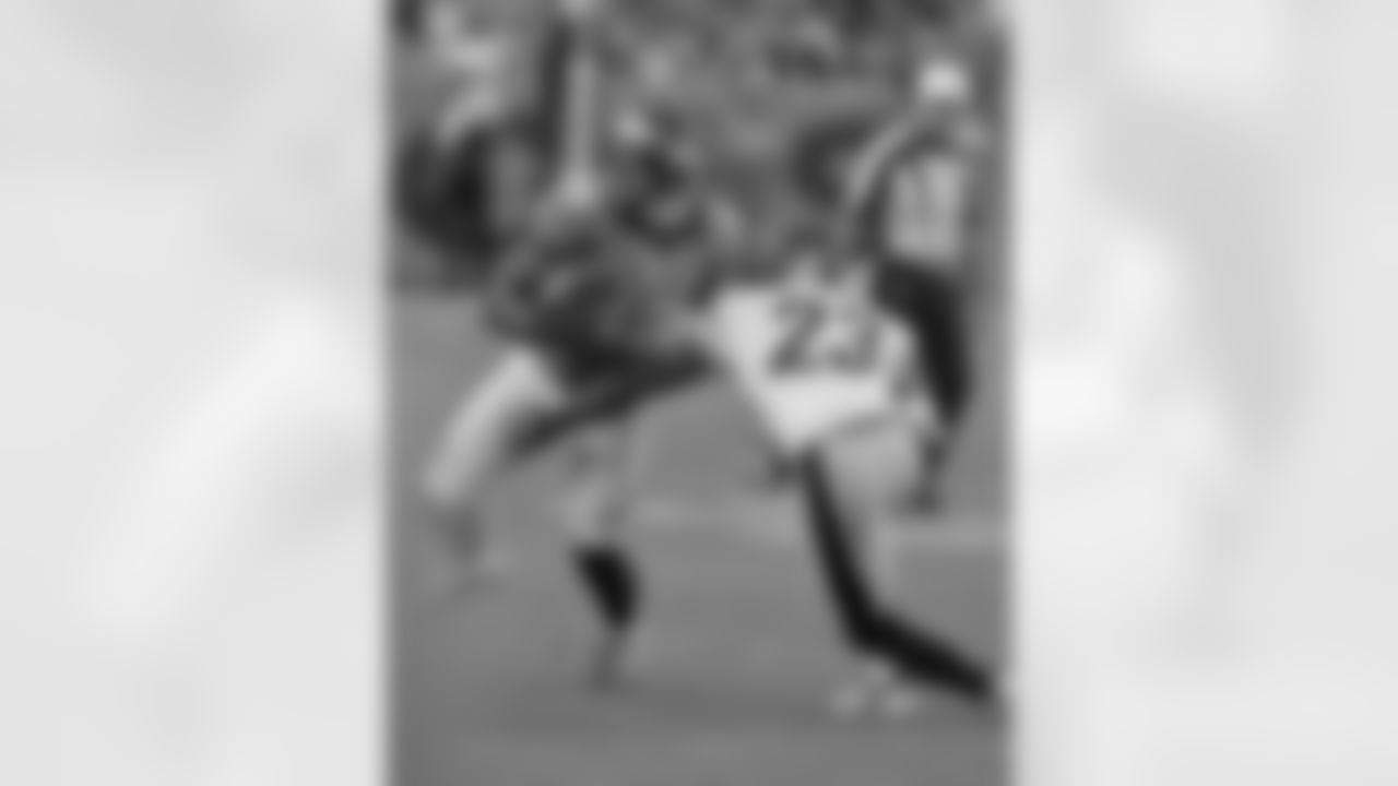 WR Demaryius Thomas puts a move on a Steelers defender after making a reception.
