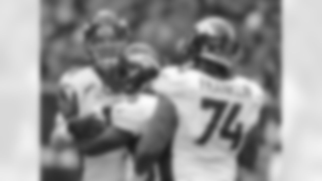 Denver Broncos quarterback Peyton Manning (18) gets a congratulatory hug from Montee Ball (28) after throwing a 4th quarter touchdown pass setting a new NFL record of 51 touchdown passes during a regular season( surpassing Tom Brady) in the NFL game against the Houston Texans in Houston TX December 22, 2013.