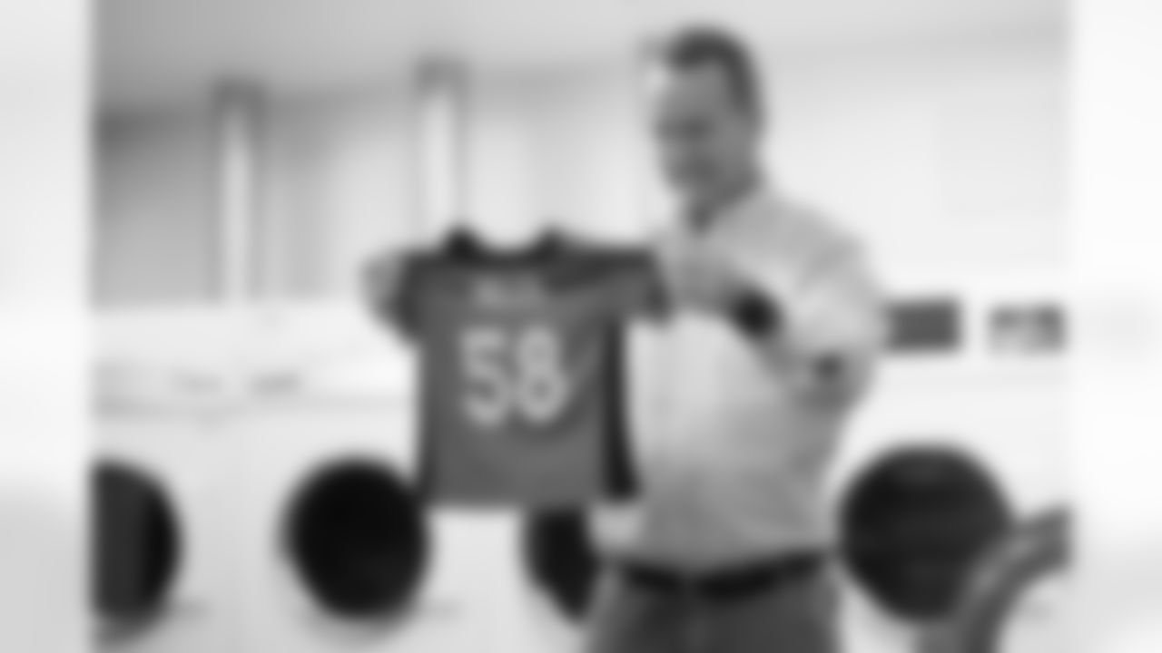During filming for the Broncos' 2021 schedule release video, former quarterback and current "intern" Peyton Manning washes a Von Miller jersey at UCHealth Training Center on May 10, 2021. (Photo by Ben Swanson)