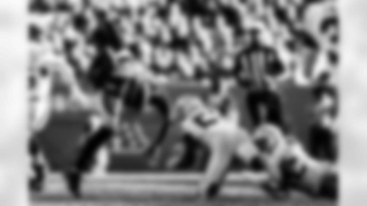 Denver Broncos quarterback Teddy Bridgewater (5) gets hit while scrambling during the NFL game against the Las Vegas Raiders on Sunday, October 17, 2021 at Empower Field at Mile High in Denver, Colorado.
Photo by Gabriel Christus