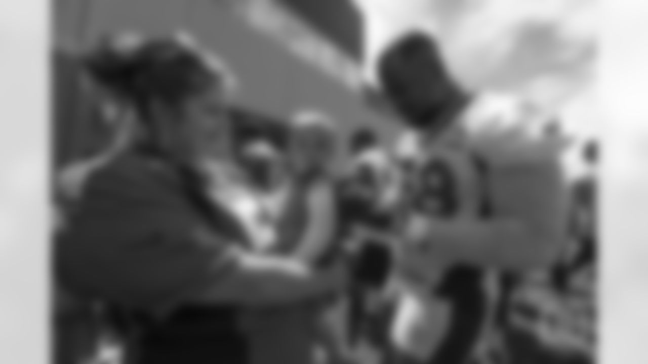 outside linebacker Von Miller (58) meets patients from Children's Hospital Colorado's burn unit after the final day of OTAs on June 7, 2018 at UCHealth Training Center.