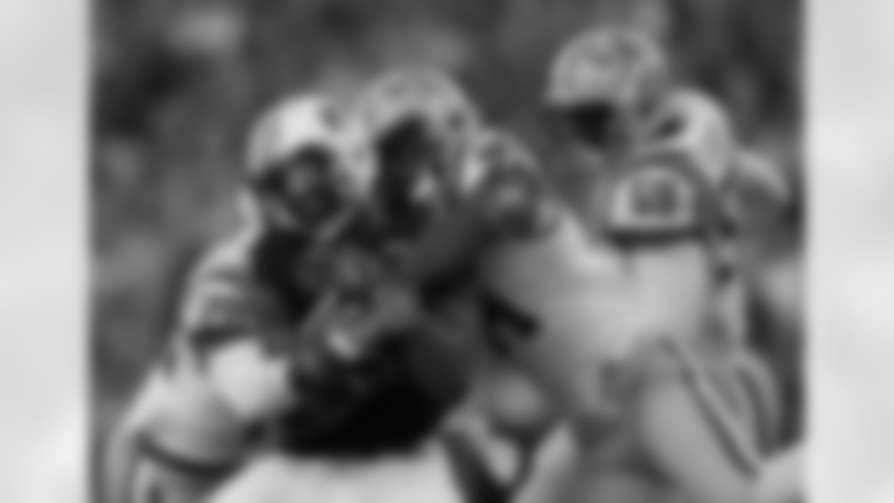 LSU defensive end Danielle Hunter (94) combines with safety Jalen Mills (28) to tackle Auburn quarterback Nick Marshall.