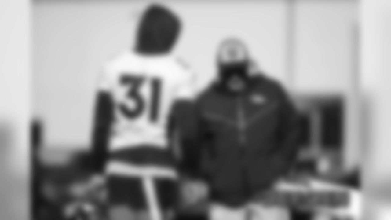 Justin Simmons talks with Head Coach Vic Fangio before practice on December 20, 2019 at UCHealth Training Center. (Photo by Ben Swanson)