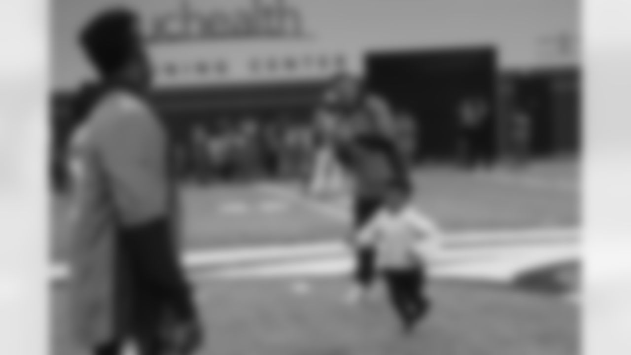 Chad Kelly prepares to throw a pass to Emmanuel Sanders' son Princeton at the 2018 Hometown Huddle PLAY 60 event at Pat Bowlen Fieldhouse on October 8, 2018.