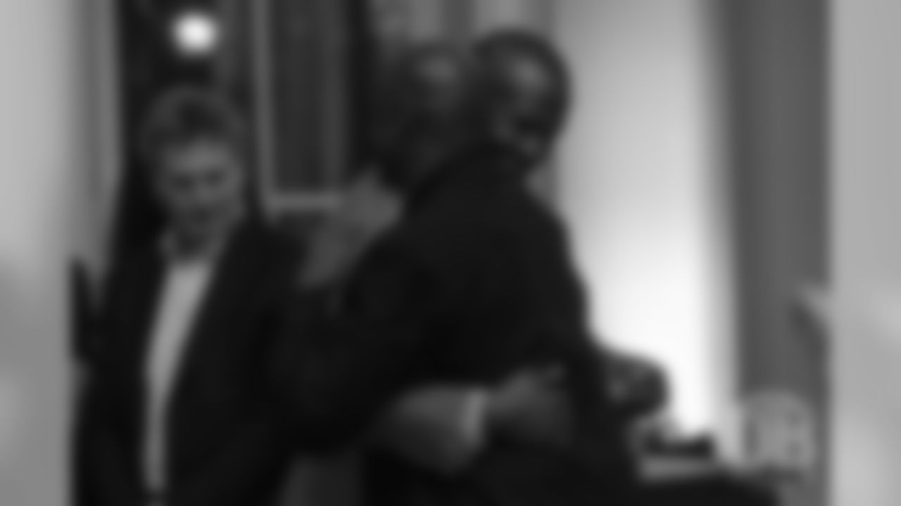 Champ Bailey greets Hall of Famer Darrell Green, who was his teammate when he started his career in Washington, at the Pro Football Hall of Fame's Celebration of Excellence Reception in Atlanta on January 31, 2019.