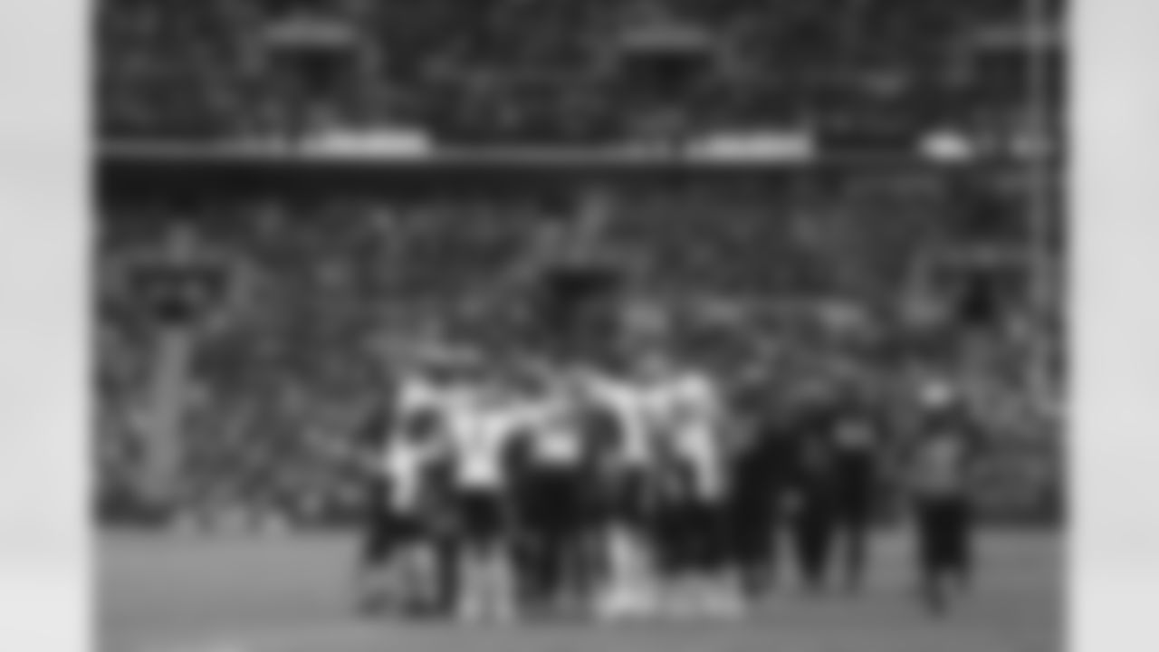 Calvin Anderson, Melvin Gordon III, KJ Hamler, Jerry Jeudy, Courtland Sutton, Greg Dulcich and others in the offensive huddle during the Broncos' Week 8 game against the Jaguars at Wembley Stadium in London on October 30, 2022. This image is part of the Broncos' film series documenting the team's trip to London. (Photo by Ben Swanson)