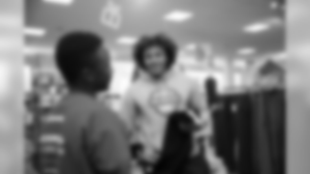 Phillip Lindsay surprises children from the Denver Broncos Boys & Girls Club with a shopping spree at a department store on December 2, 2019. (Photo by Ben Swanson)