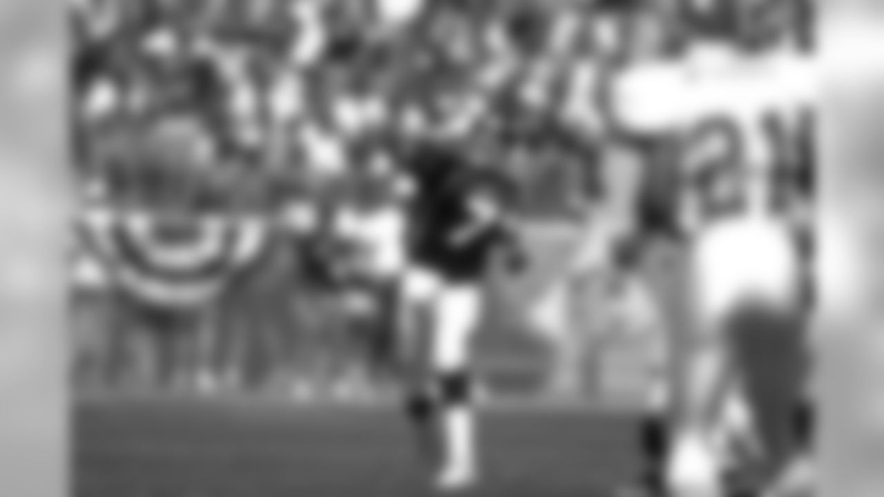 Denver: John Elway passes the ball against the Kansas City Chiefs at Mile High Stadium in Denver, CO on August 31, 1997.