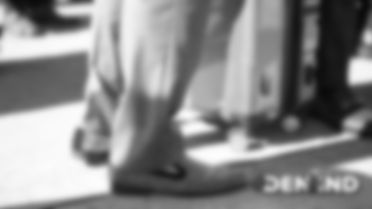 Phillip Lindsay's shoes on the tarmac at Denver International Airport during the team's travel to Indiana on October 26, 2019 ahead of their Week 8 game against the Indianapolis Colts. (Photo by Ben Swanson)