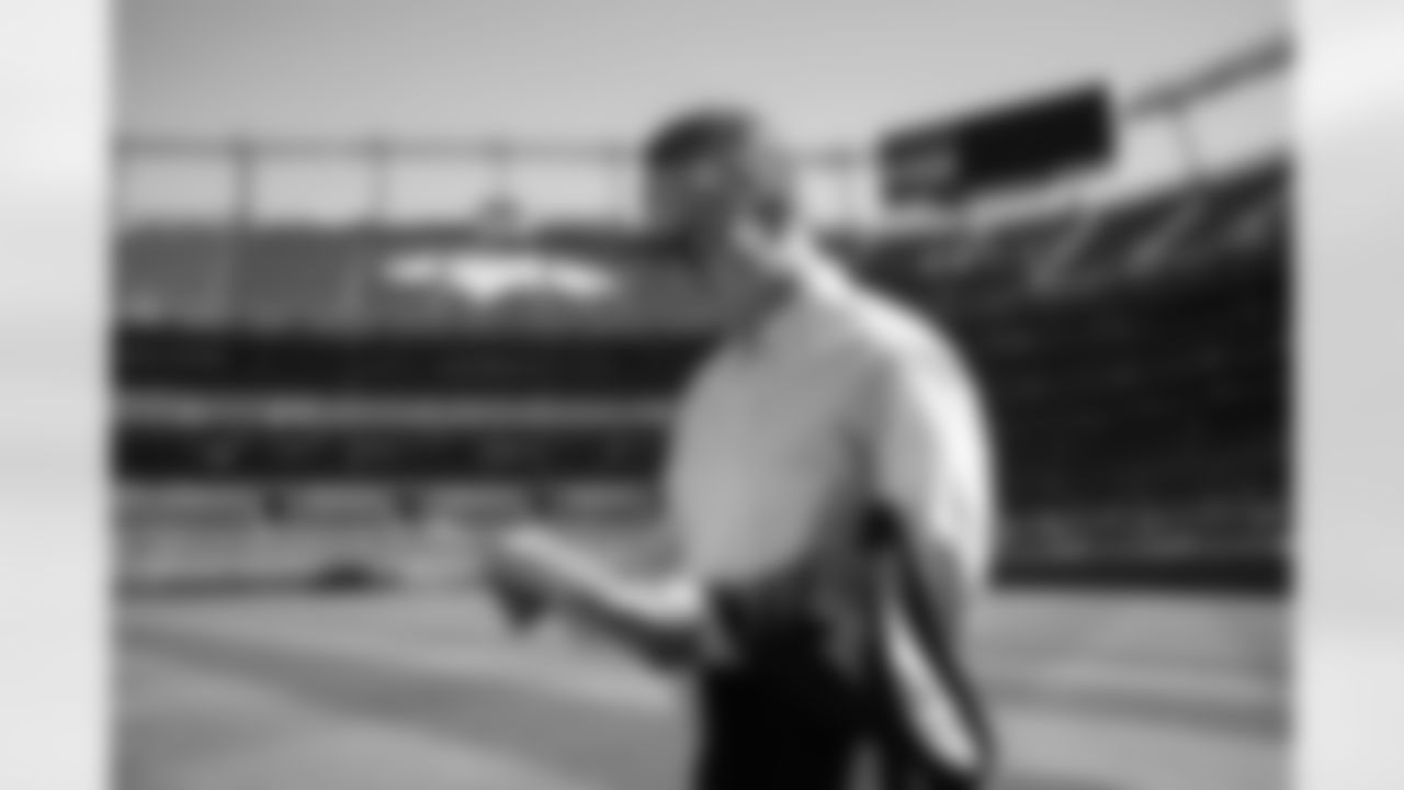 Peyton Manning reviews interview notes during the taping of an episode of Peyton's Places at Empower Field at Mile High on June 26, 2020. (Photo by Ben Swanson)
