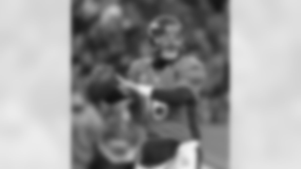 Quarterback Peyton Manning, who finished the night 23-of-29 for 304 yards passing and three touchdowns through the air, drops back to pass.