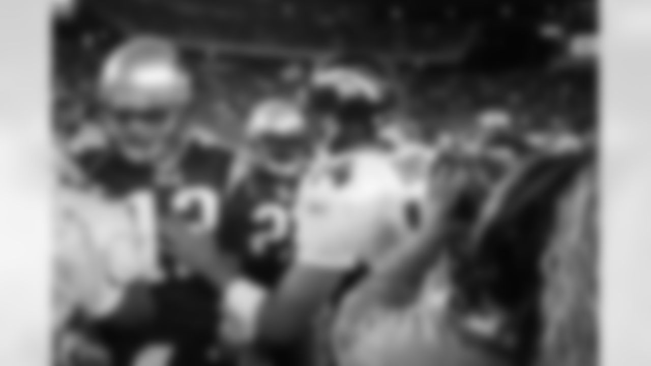 Brian Griese greets with Tom Brady after the Broncos victory against the New England Patriots at Gillette Stadium in Foxborough, MA on October 27, 2002.