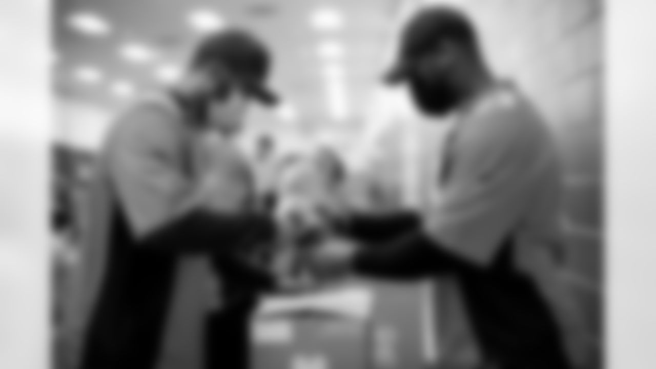 Justin Strnad and Jonathon Cooper at an event packaging food supplies for Food Bank of the Rockies at their warehouse on September 14, 2021. (Photo by Ben Swanson)