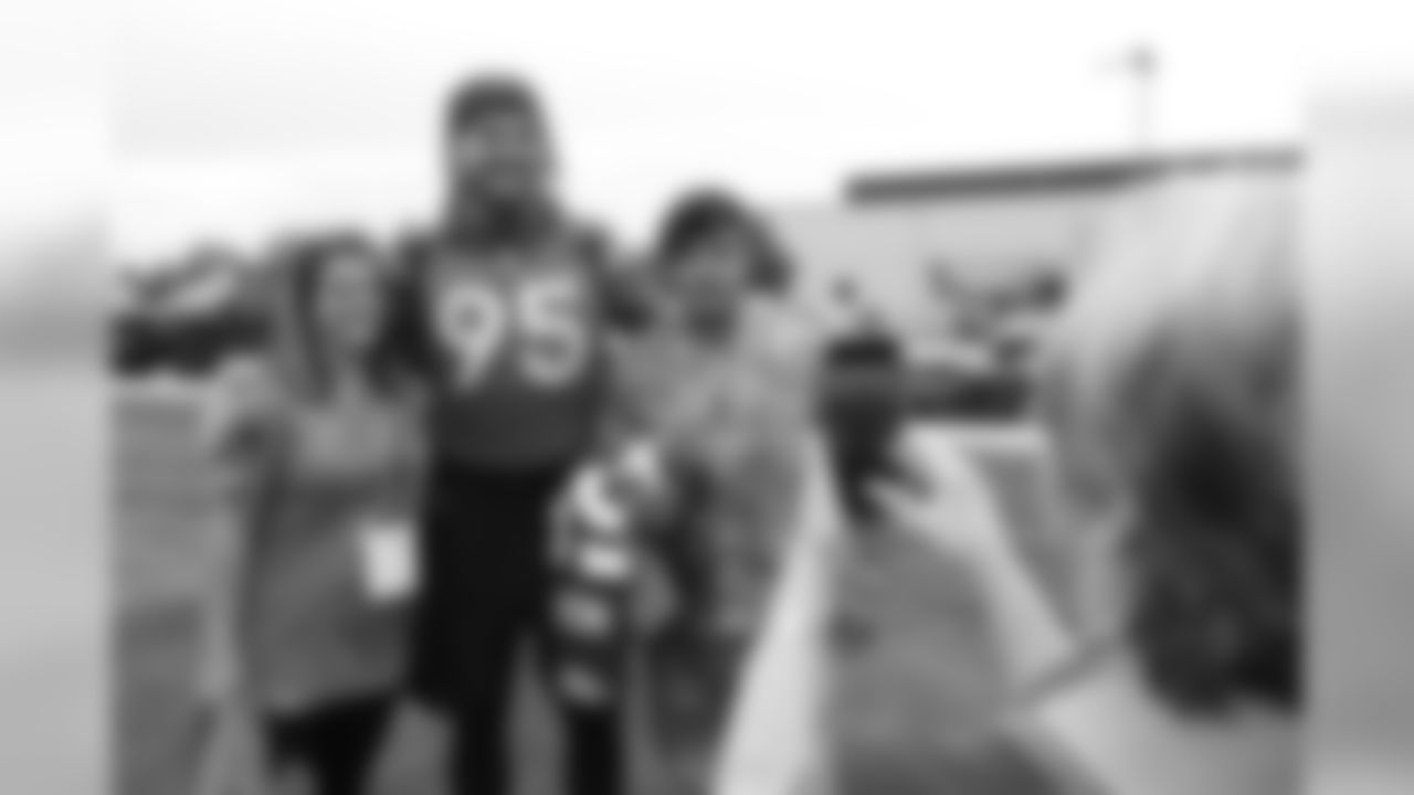 Derek Wolfe takes a photo with Sarah Lindsay, a Gold Star wife after practice in Englewood, Colorado, August 21, 2019.
Photo by Gabriel Christus
