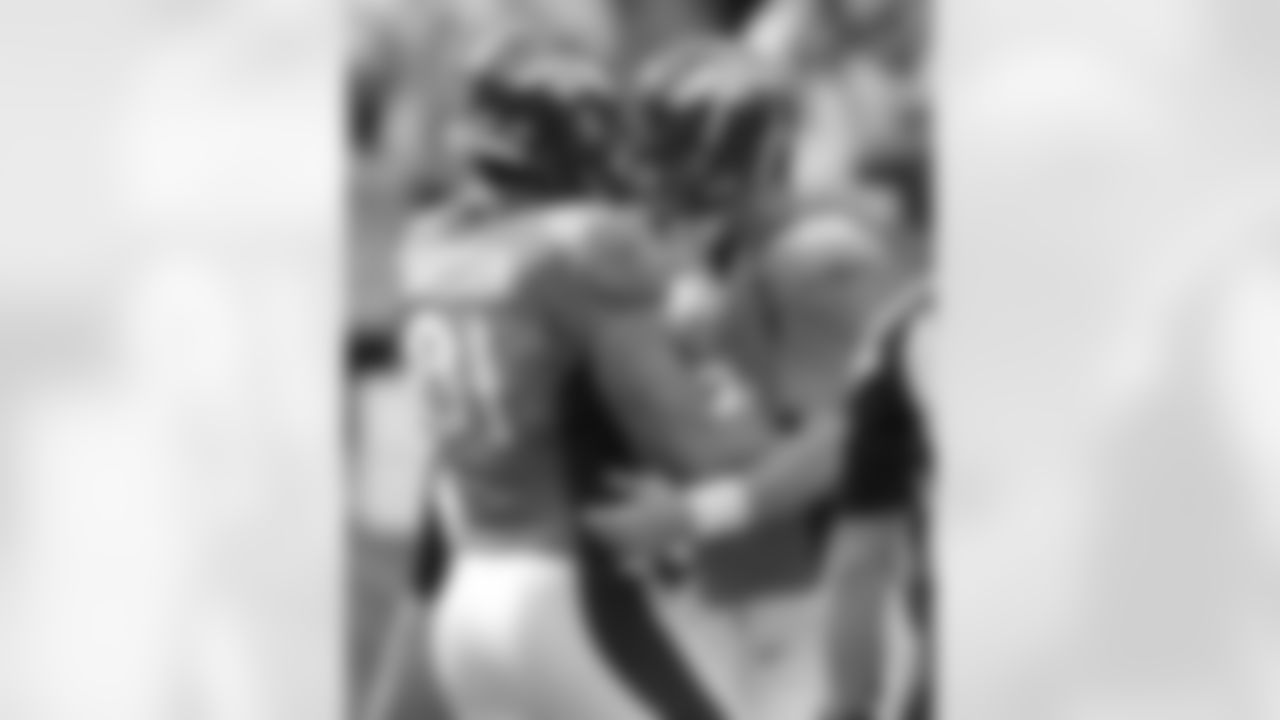 TE Joel Dreessen and QB Peyton Manning celebrate a first-quarter touchdown reception.