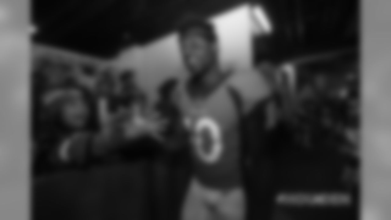 Emmanuel Sanders high-fives fans in the tunnel during player introductions before the Broncos' Week 9 game against the Houston Texans at Broncos Stadium at Mile High on November 4, 2018.