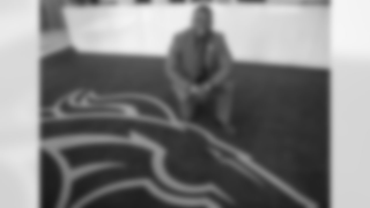Ball poses on the Broncos carpet.