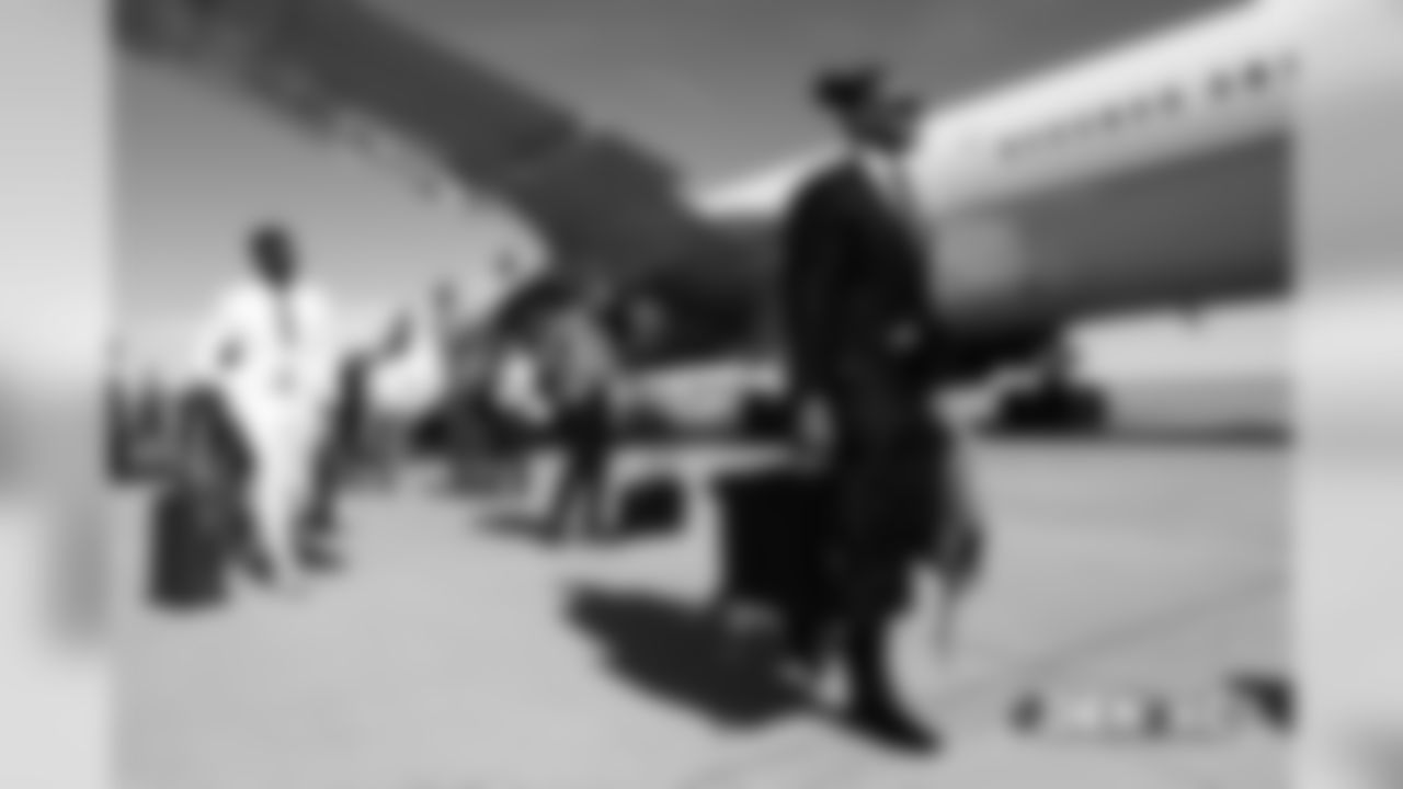 Todd Davis walks on the tarmac to the plane before the flight during the team's travel for their Week 8 game against the Kansas City Chiefs on October 27, 2018.