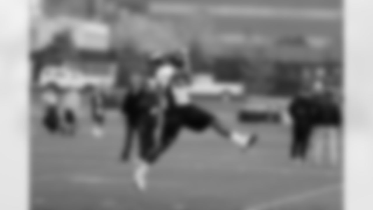 CB Coryell Judie comes down with an interception during positional drills.