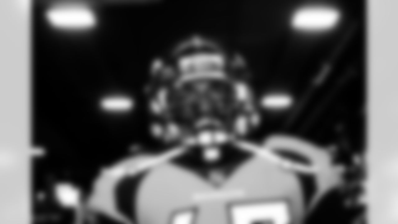 Alexander Johnson yells in the tunnel during player and team introductions before the game against the Baltimore Ravens on October 3, 2021 at Empower Field at Mile High in Denver, Colorado. (Photo by Ben Swanson)
