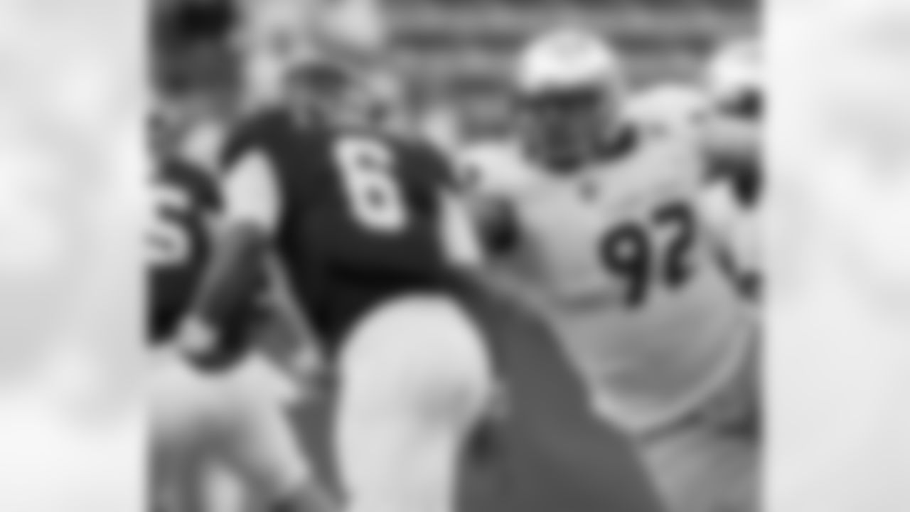 Fresno State defensive tackle Tyeler Davison reaches out trying to get his hands on Rice quarterback Driphus Jackson.