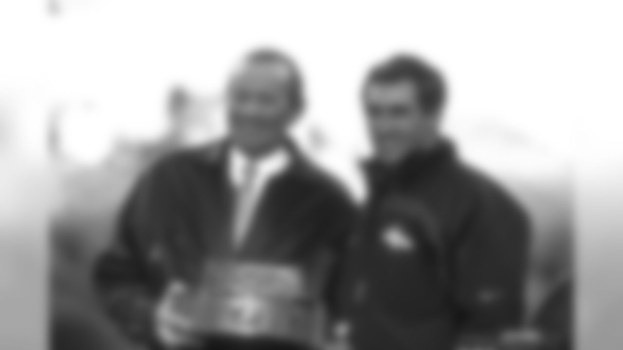 Owner Pat Bowlen and Head Coach Mike Shanahan pose with the AFC Championship trophy after the Broncos' victory against the Pittsburgh Steelers at Three Rivers Stadium in Pittsburgh, PA on January 11, 1998.