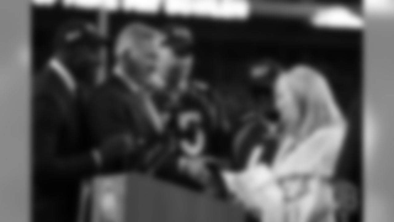 Broncos Hall of Famers Shannon Sharpe, John Elway, Gary Zimmerman and Floyd Little congratulate Annabel Bowlen after her speech during Ring of Fame induction ceremonies for her husband, Broncos Owner Pat Bowlen, on Nov. 1, 2015.