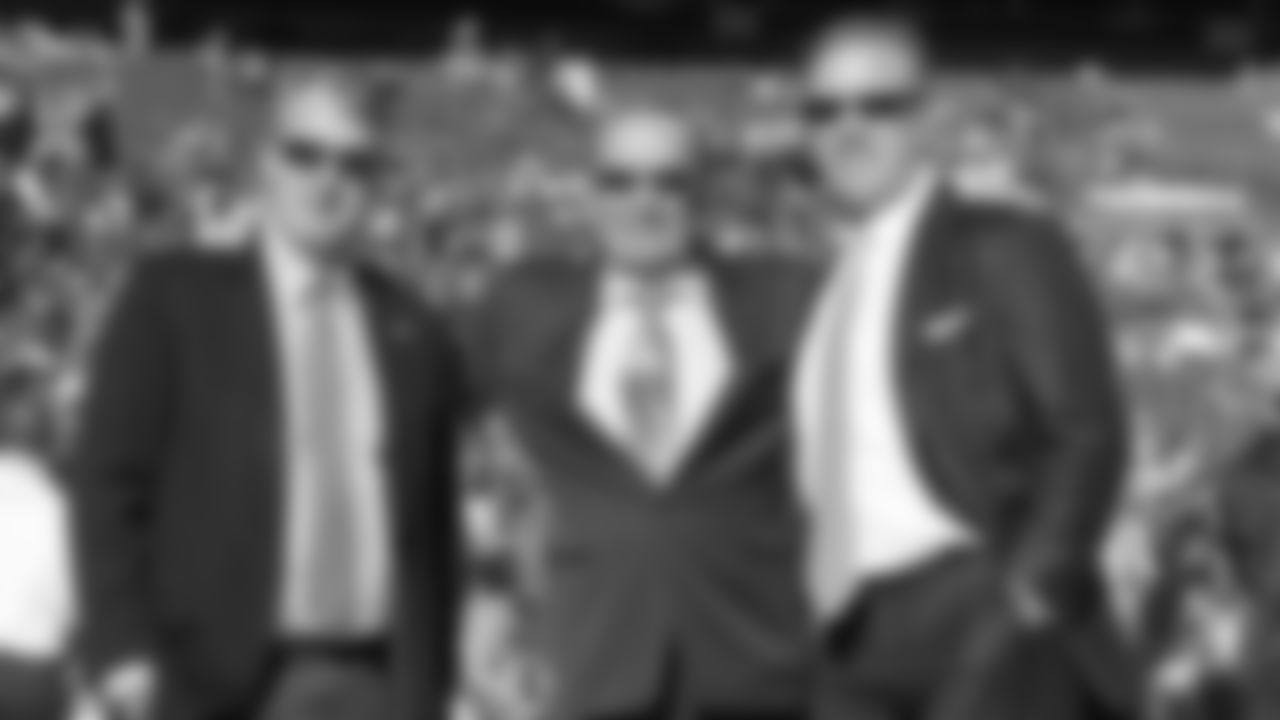 Denver Broncos owner and CEO Pat Bowlen with president Joe Ellis (L) and executive vice president John Elway (R) before action against the New England Patriots in the AFC Championship playoff NFL game at Sports Authority Field in Denver, CO on January 19, 2014.