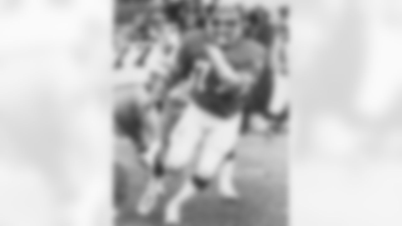 Defensive tackle Lyle Alzado rushes the Steelers quarterback during a game at Mile High Stadium.