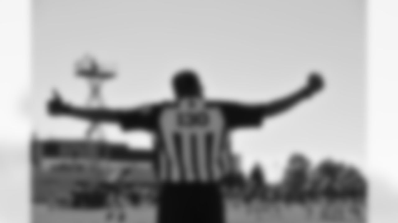 Officials watched the Broncos' practice on Thursday.
