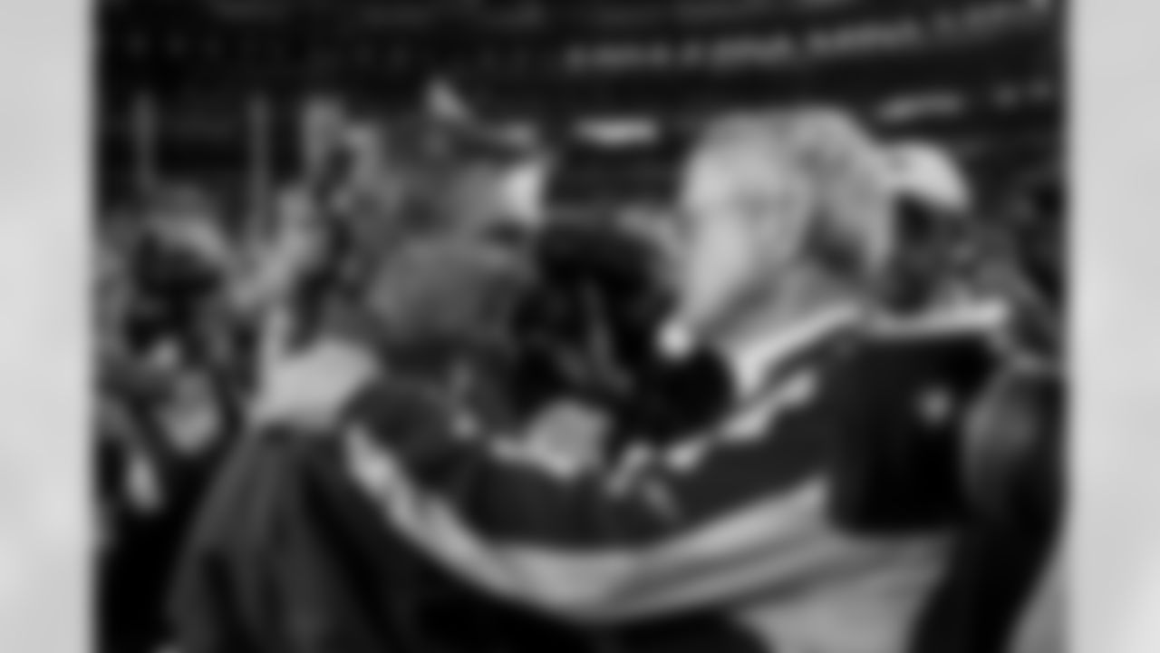 Mike Shanahan greets with Dick Vermeil after the Broncos victory over the Chiefs against the Kansas City Chiefs at Invesco Field at Mile High in Denver, CO on December 7, 2003.