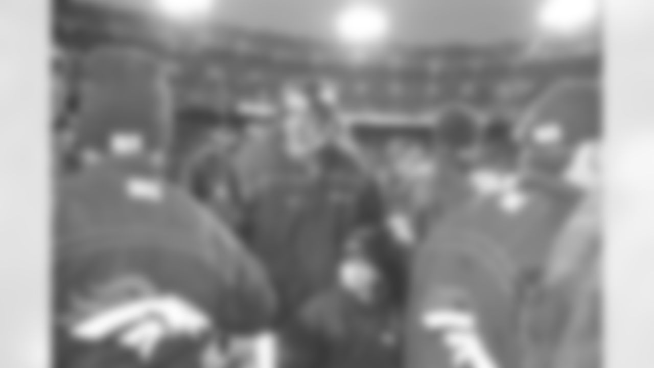 Denver: John Elway and his son Jack make their way off the field after the Broncos first round wild card victory against the Jaguars against the Jacksonville Jaguars at Mile High Stadium in Denver, CO on December 27, 1997.