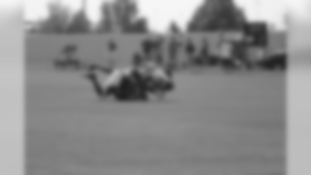Moore goes low to secure an interception during one-on-ones.