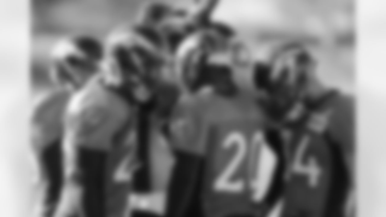 The defensive backs huddle it up during practice.
