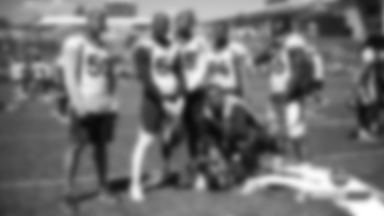 Aaron Wallace, Von Miller, Bradley Chubb, Ahmad Gooden, Justin Hollins and Dekoda Watson pose for a group photo after practice on Day 17 of training camp on August 13, 2019.
