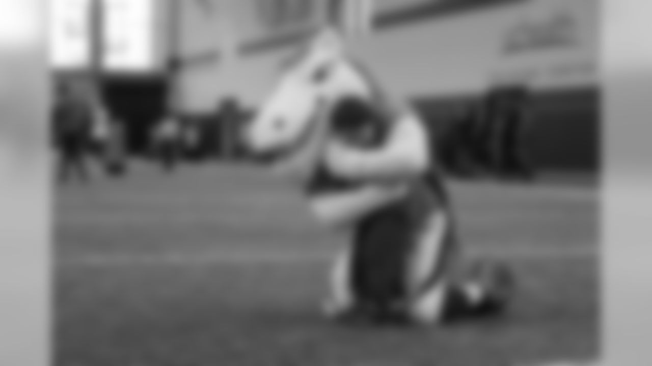 Miles the mascot wraps a young fan up in a big hug during a PLAY 60 All-Ability Clinic with the National Sports Center for the Disabled for 200 athletes at UCHealth Training Center at April 30, 2019.