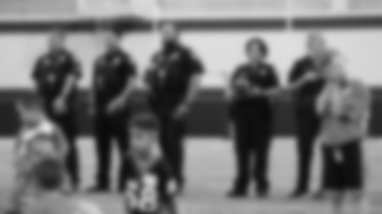 Law enforcement officers listen to introductions during a PLAY 60 All-Ability Clinic with Special Olympics Colorado for 125 athletes at UCHealth Training Center at May 7, 2019.