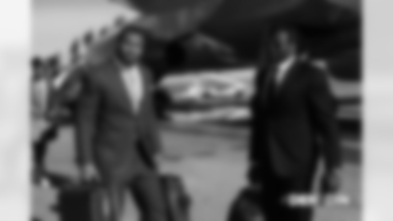 Bradley Chubb and Jeff Holland on the tarmac before the flight during the team's travel for their Week 13 game against the Cincinnati Bengals on December 1, 2018. Photo by Gabriel Christus