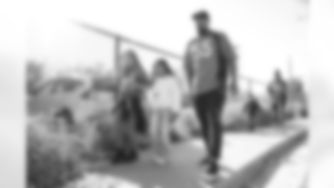 Bradley Chubb and children during the Miles for Miles community event series encouraging outdoor activity for children at Boston Elementary School in Aurora, Colorado on October 12, 2022. (Photo by Ben Swanson)