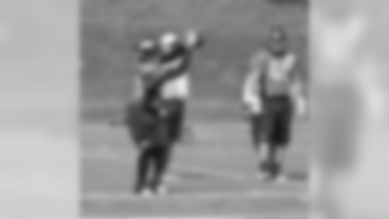 RB Xavier Omon makes a catch along the sideline.