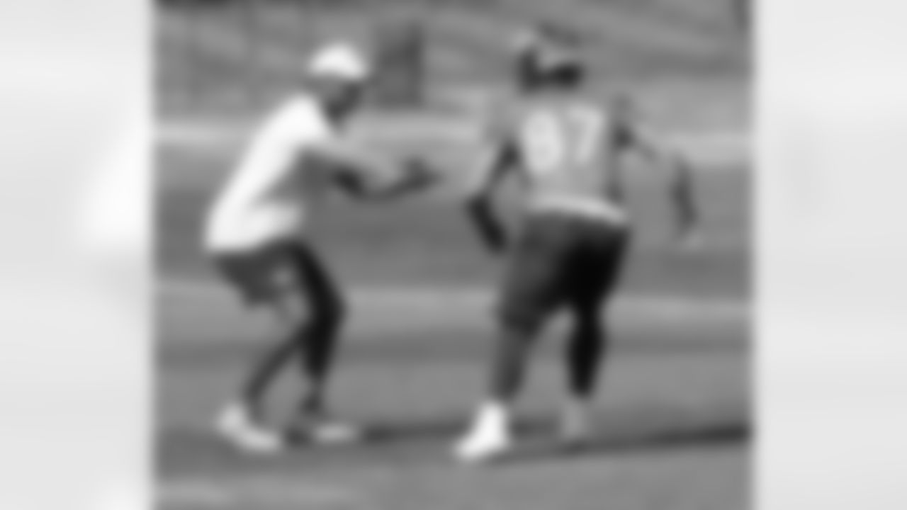 WR Coach Tyke Tolbert presses Decker as the receiver begins his route.