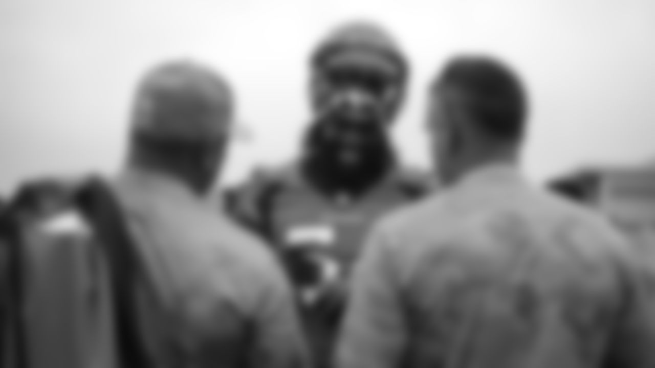 Dekoda Watson signs autographs for military members from the USAA Salute to Service NFL Boot Camp after practice on August 21, 2019 at UCHealth Training Center.