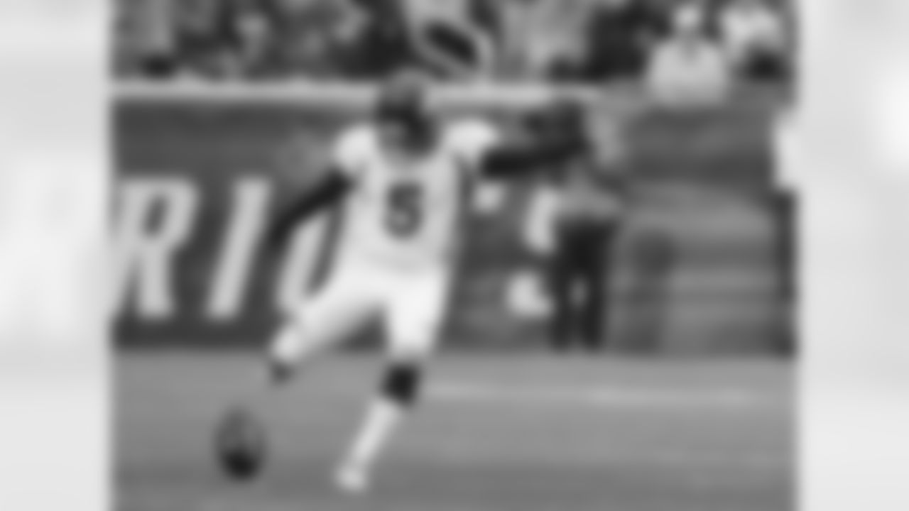 K Matt Prater boots a kickoff during the first half against the New England Patriots.
