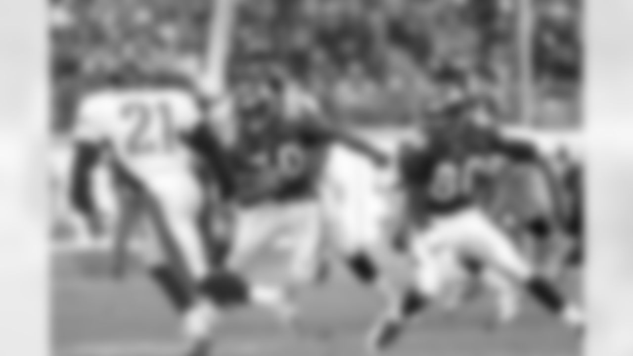 Denver: Running back Terrell Davis cuts back against the grain and heads up field looking for a block from teammate Rod Smith against the Jacksonville Jaguars at Mile High Stadium in Denver, CO on December 27, 1997.
